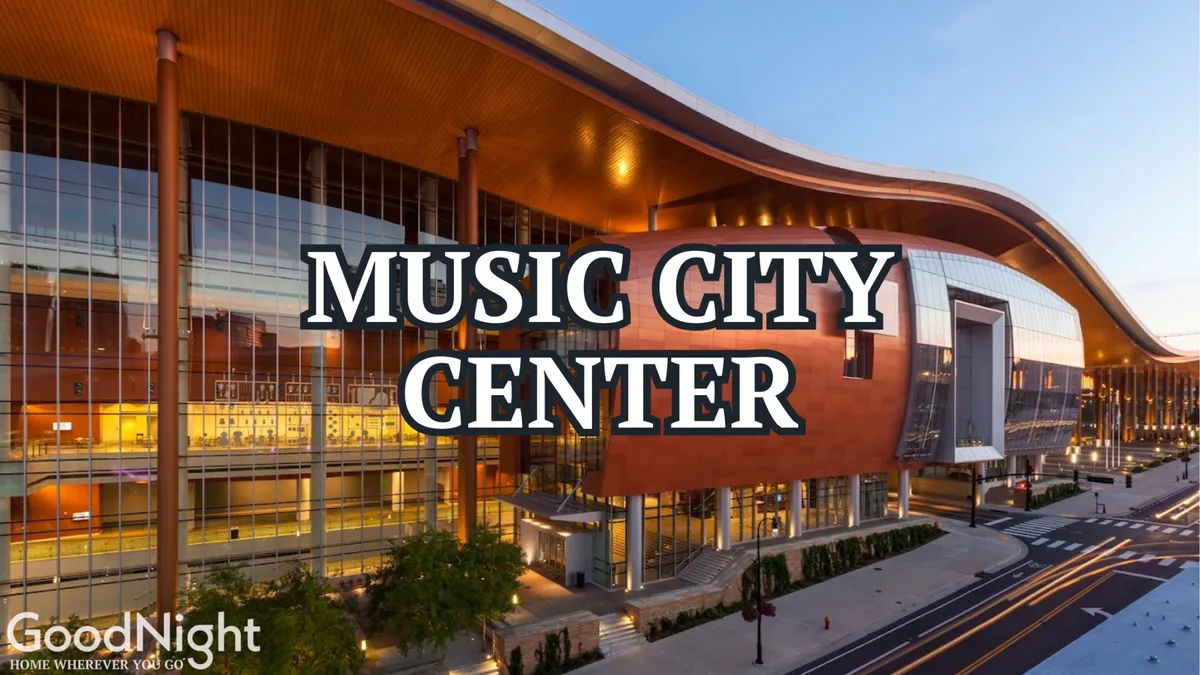 A wide exterior shot of the impressive Music City Center, featuring its distinctive curved rooflines and contemporary glass facade, set against the vibrant backdrop of downtown Nashville. The building is a hub of activity, hinting at conventions, concerts, and networking events taking place inside.