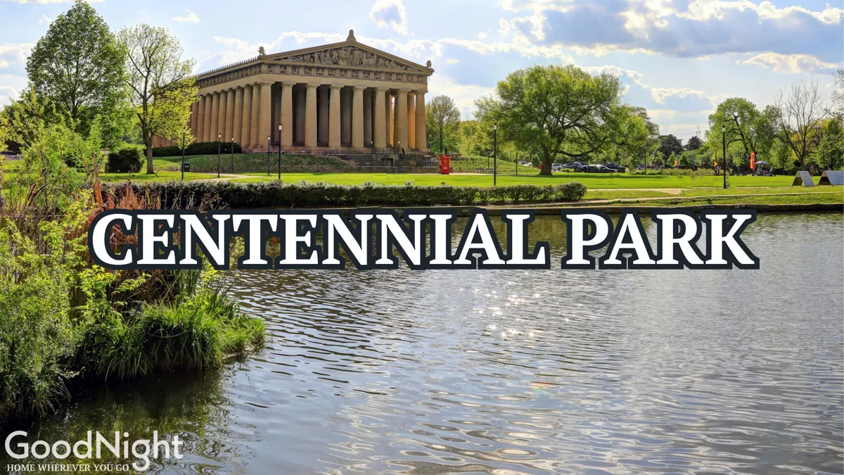 This exterior image captures the iconic Parthenon in Centennial Park, reflected beautifully on the tranquil water, with lush greenery surrounding the scene. Families can be imagined picnicking or strolling along the pathways, enjoying the park's expansive outdoor space.
