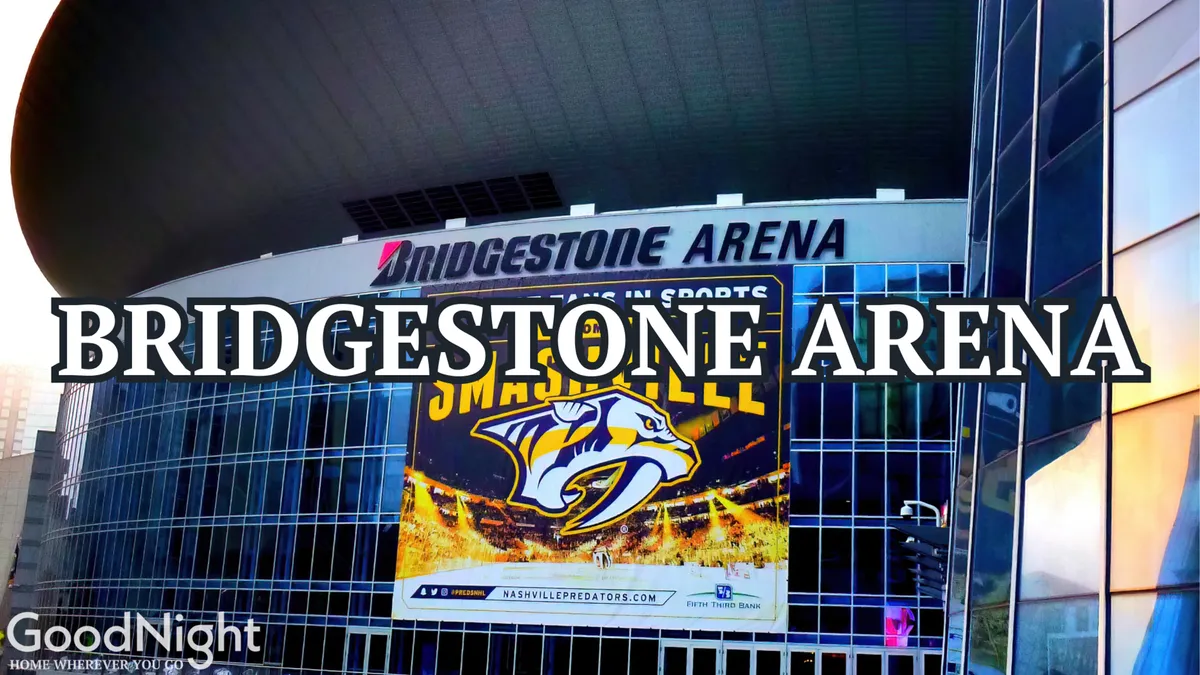 A clear exterior shot of the Bridgestone Arena signage, prominently displaying the Nashville Predators logo and a large promotional banner. The setting is busy with activity, capturing the anticipation and excitement of major events.